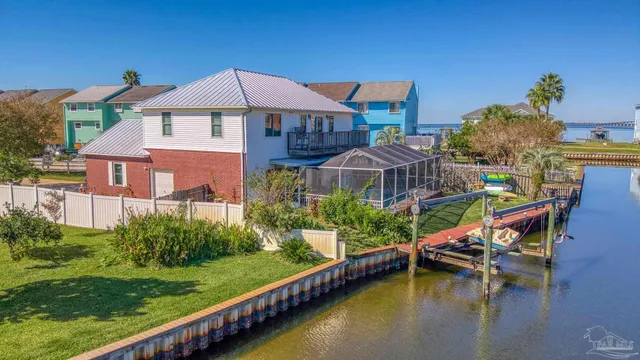a front view of a house with swimming pool yard and outdoor seating