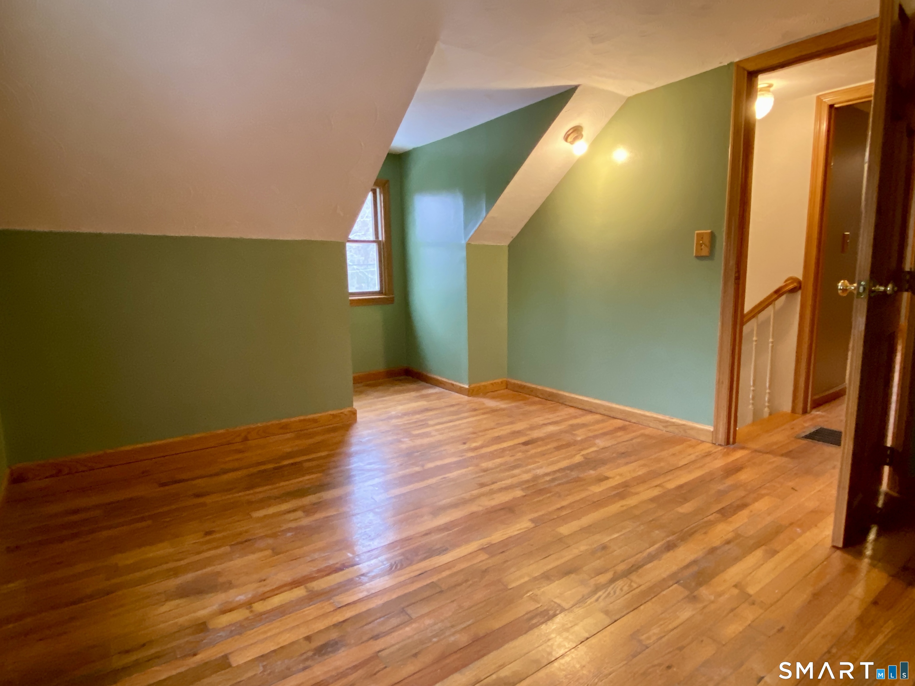 8 S Road Ellington, CT 06029 - Photo 18 of 21 a view of a big room with wooden floor and windows