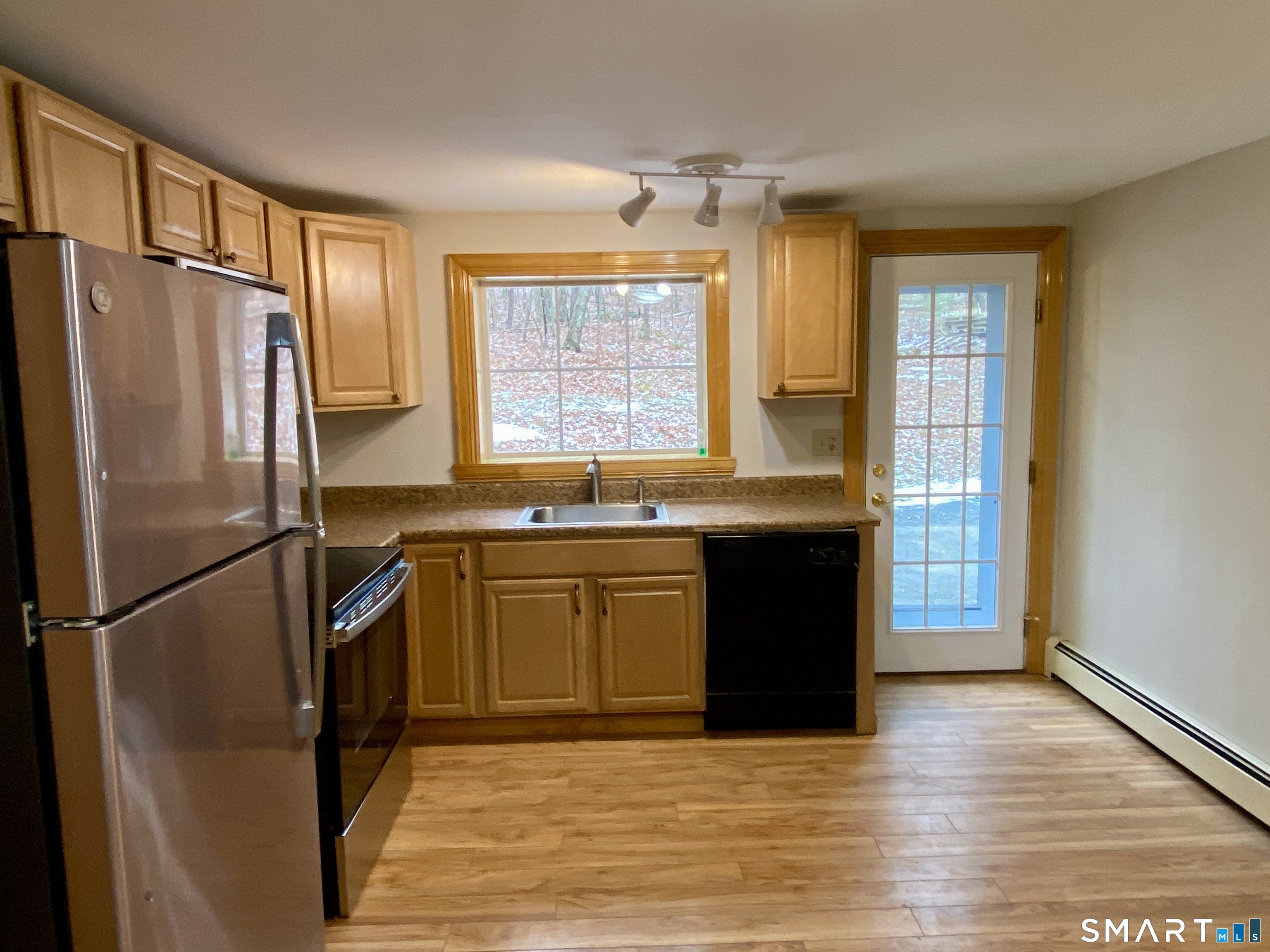 8 S Road Ellington, CT 06029 - Photo 8 of 21 a kitchen with stainless steel appliances granite countertop a refrigerator a sink and a stove