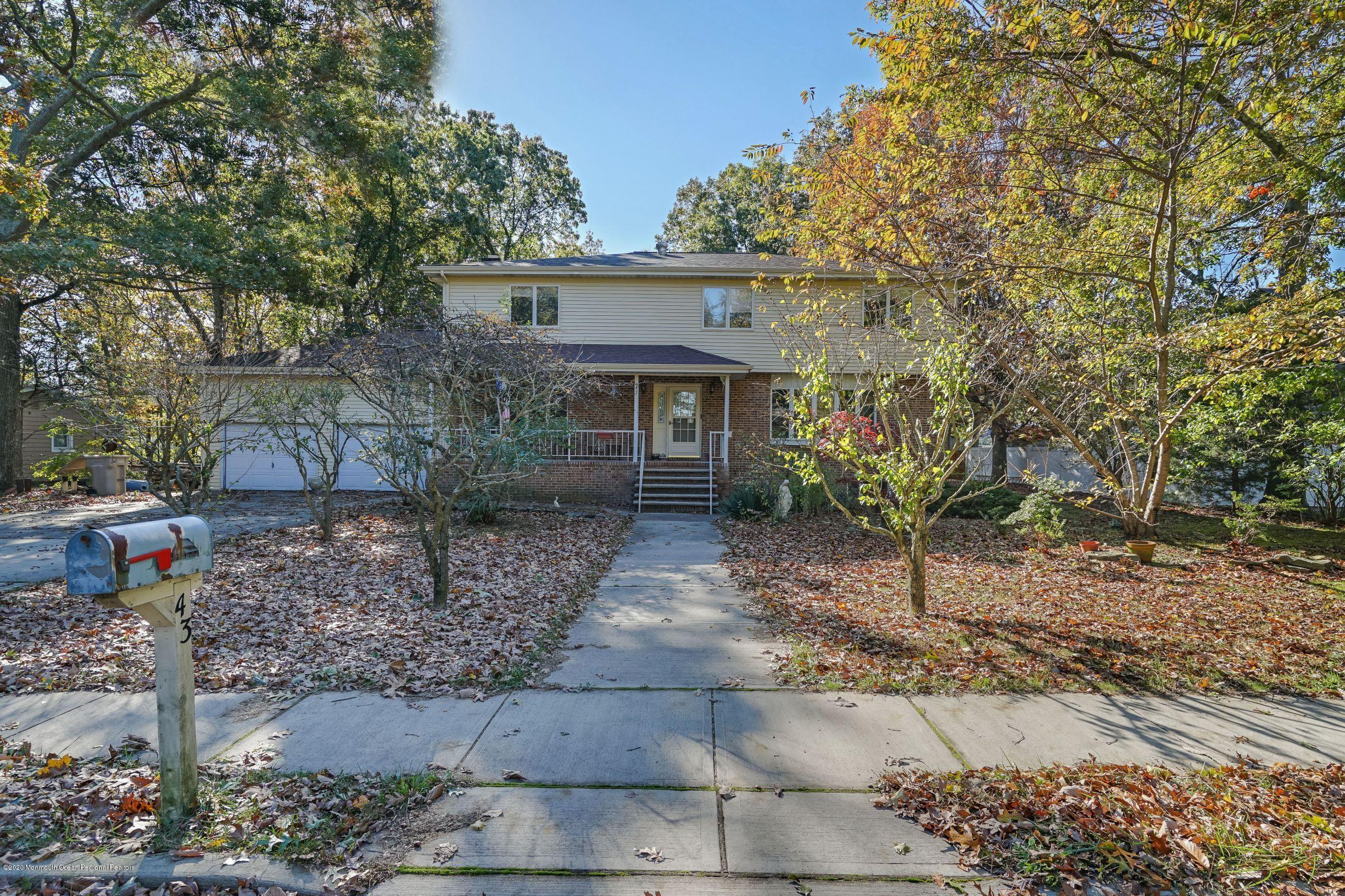 43 Korman Road Bayville, NJ 08721 - Photo 1 of 47 a front view of a house with garden