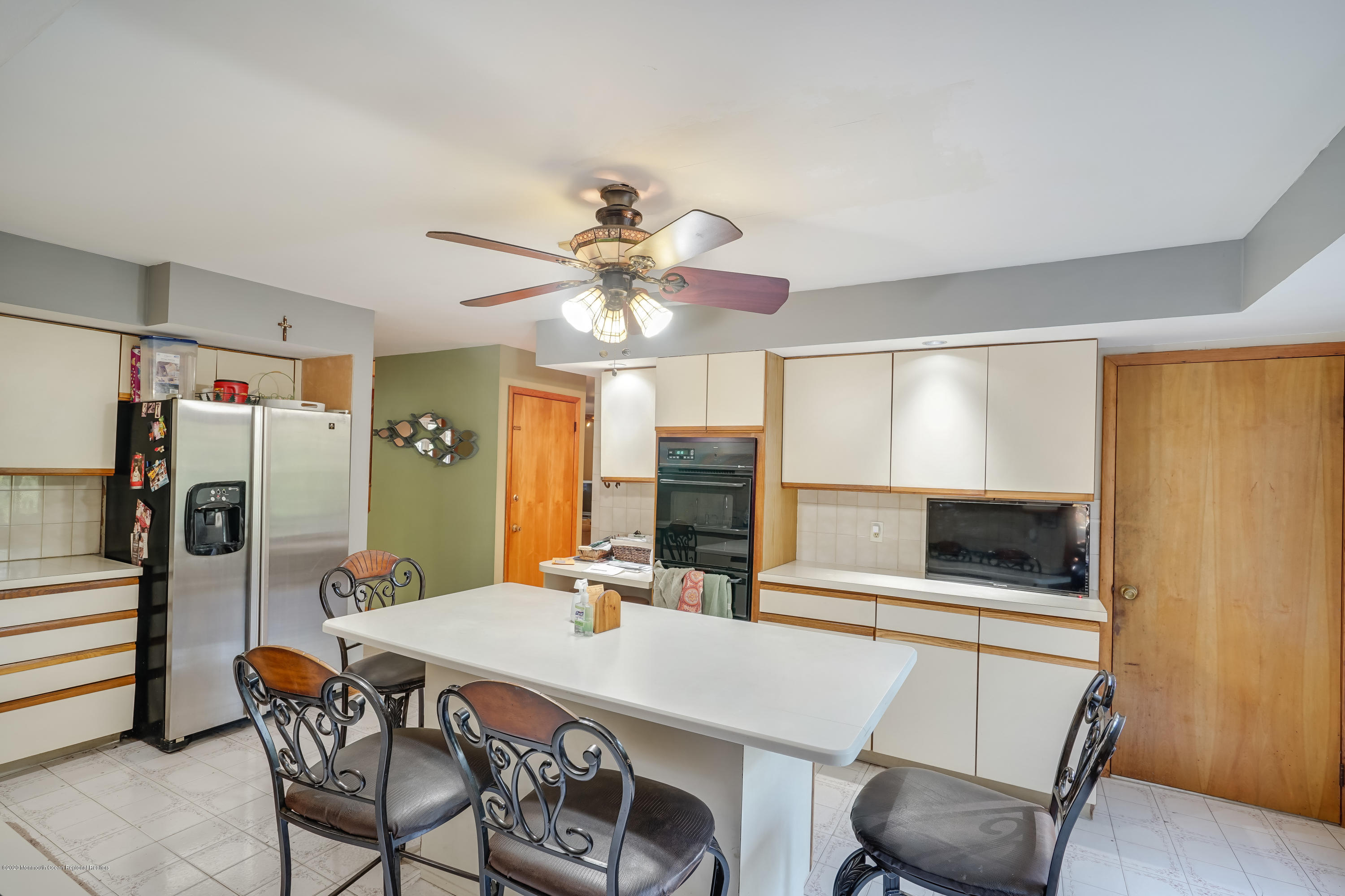 43 Korman Road Bayville, NJ 08721 - Photo 12 of 47 a view of a dining room with furniture and a chandelier