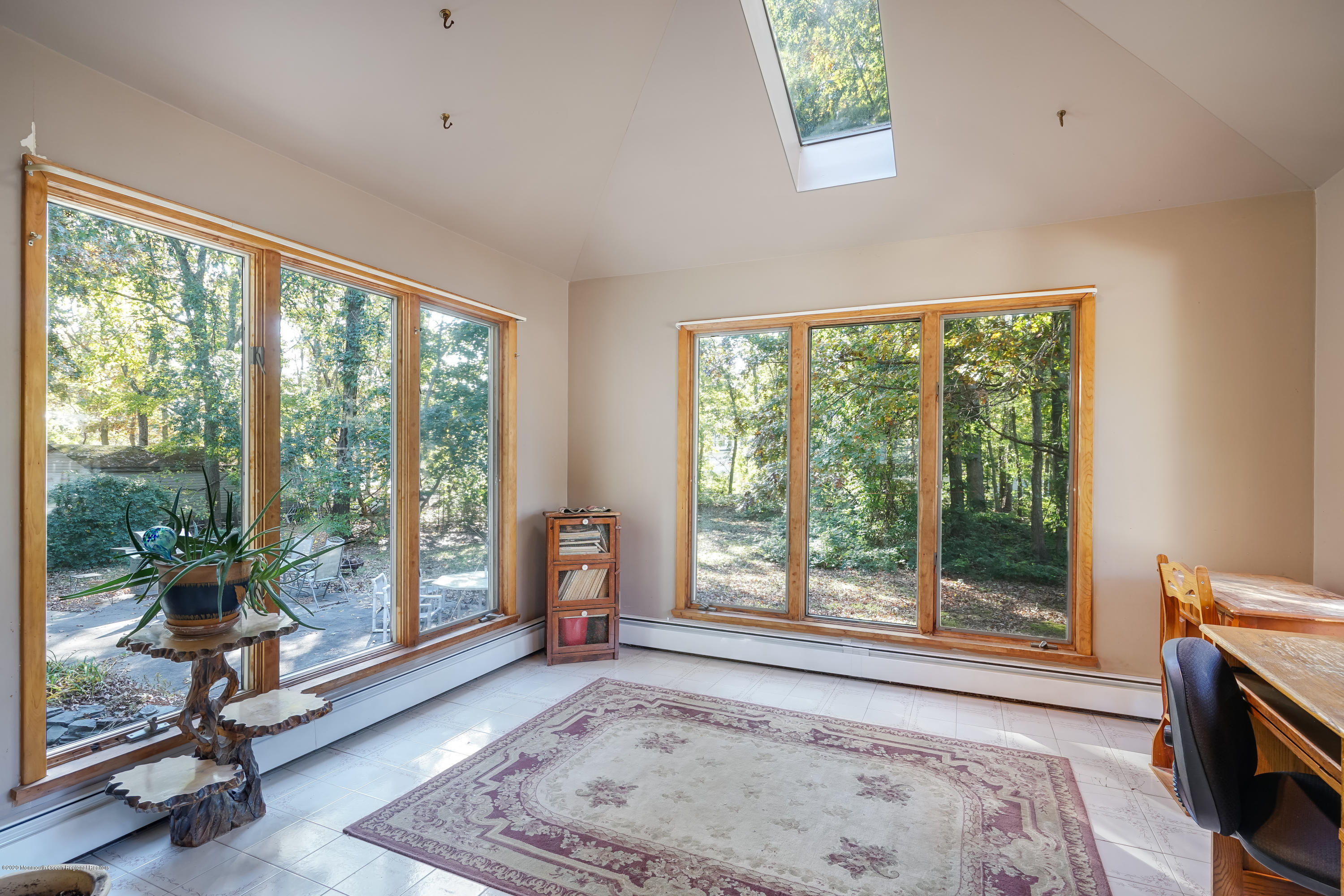 43 Korman Road Bayville, NJ 08721 - Photo 13 of 47 a view of a bedroom with a large window and a bed