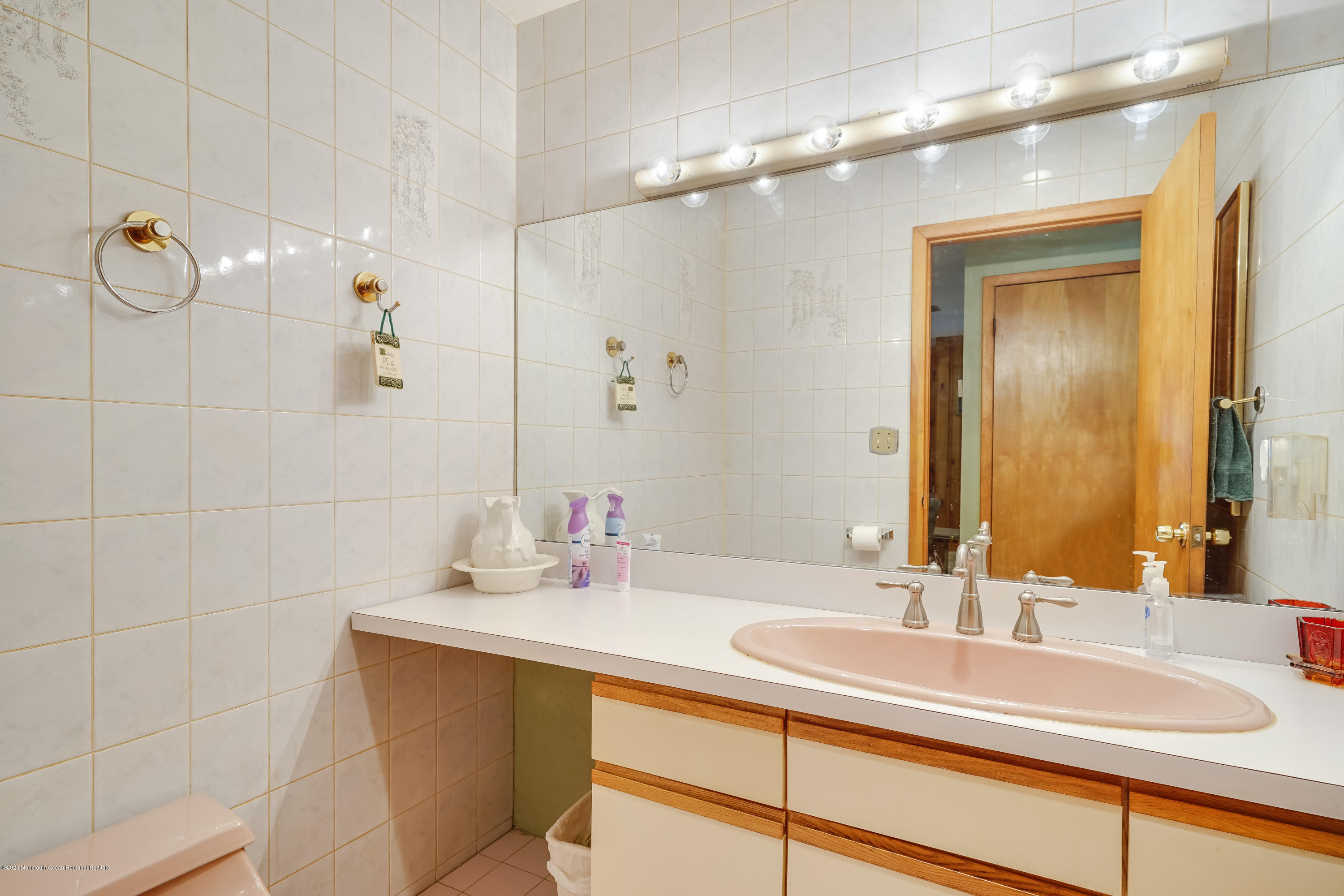 43 Korman Road Bayville, NJ 08721 - Photo 19 of 47 a bathroom with a sink and a mirror