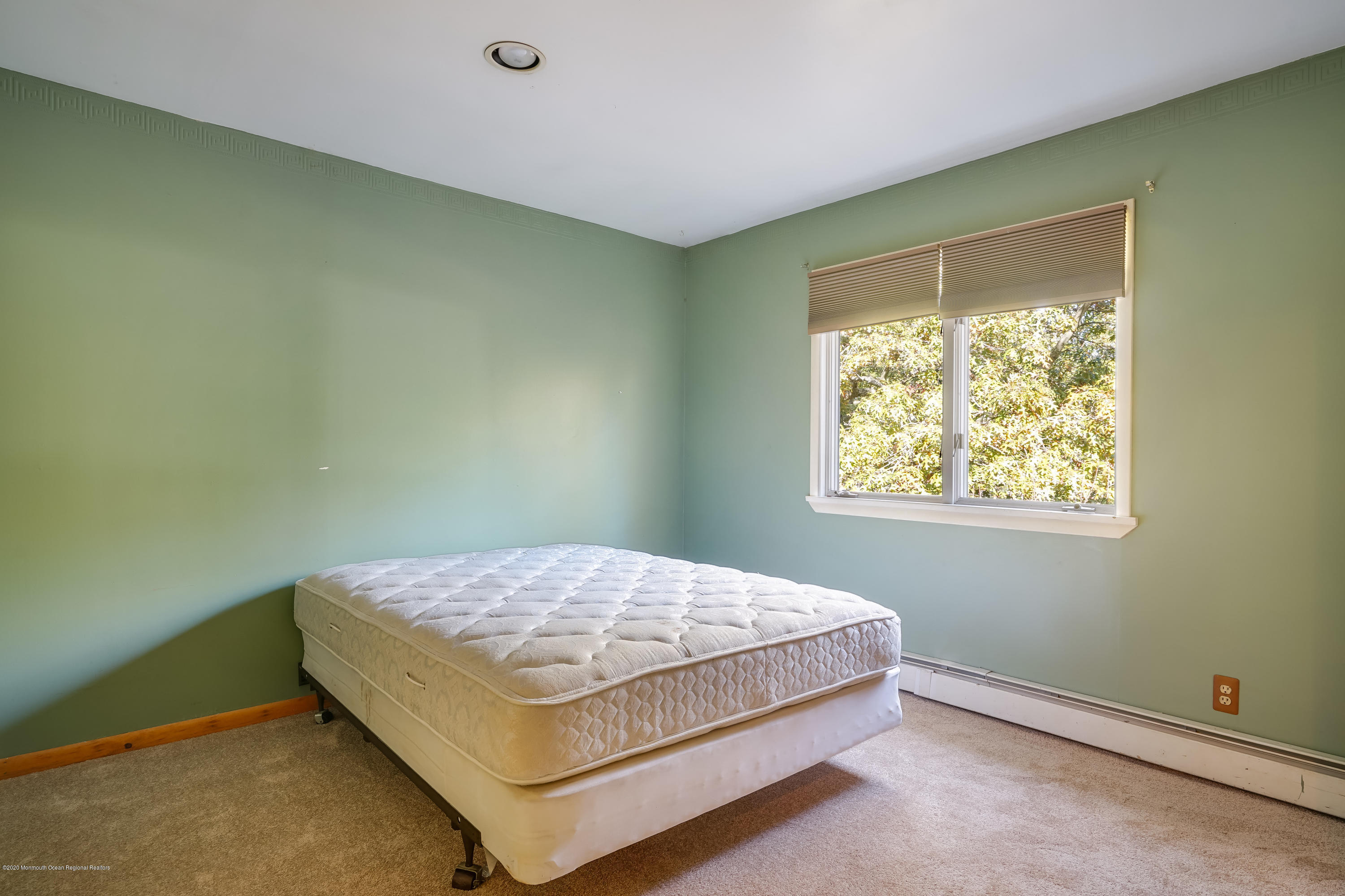 43 Korman Road Bayville, NJ 08721 - Photo 23 of 47 a bedroom with a bed and window
