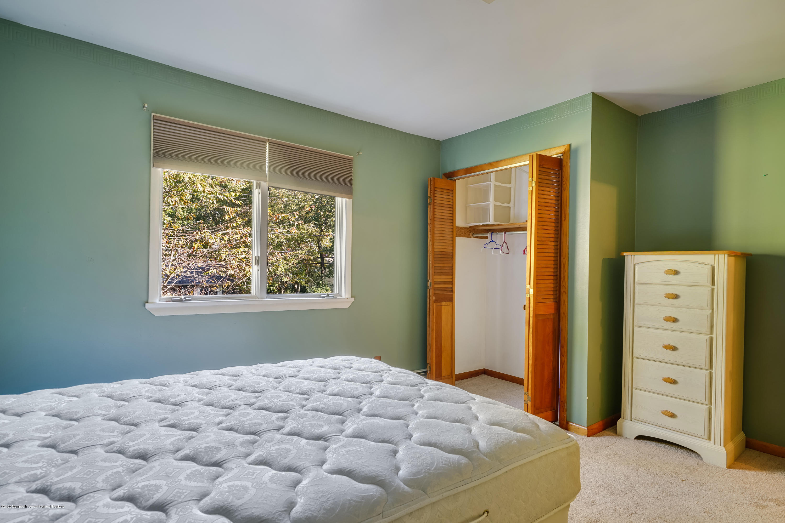 43 Korman Road Bayville, NJ 08721 - Photo 24 of 47 a bedroom with a bed and a window