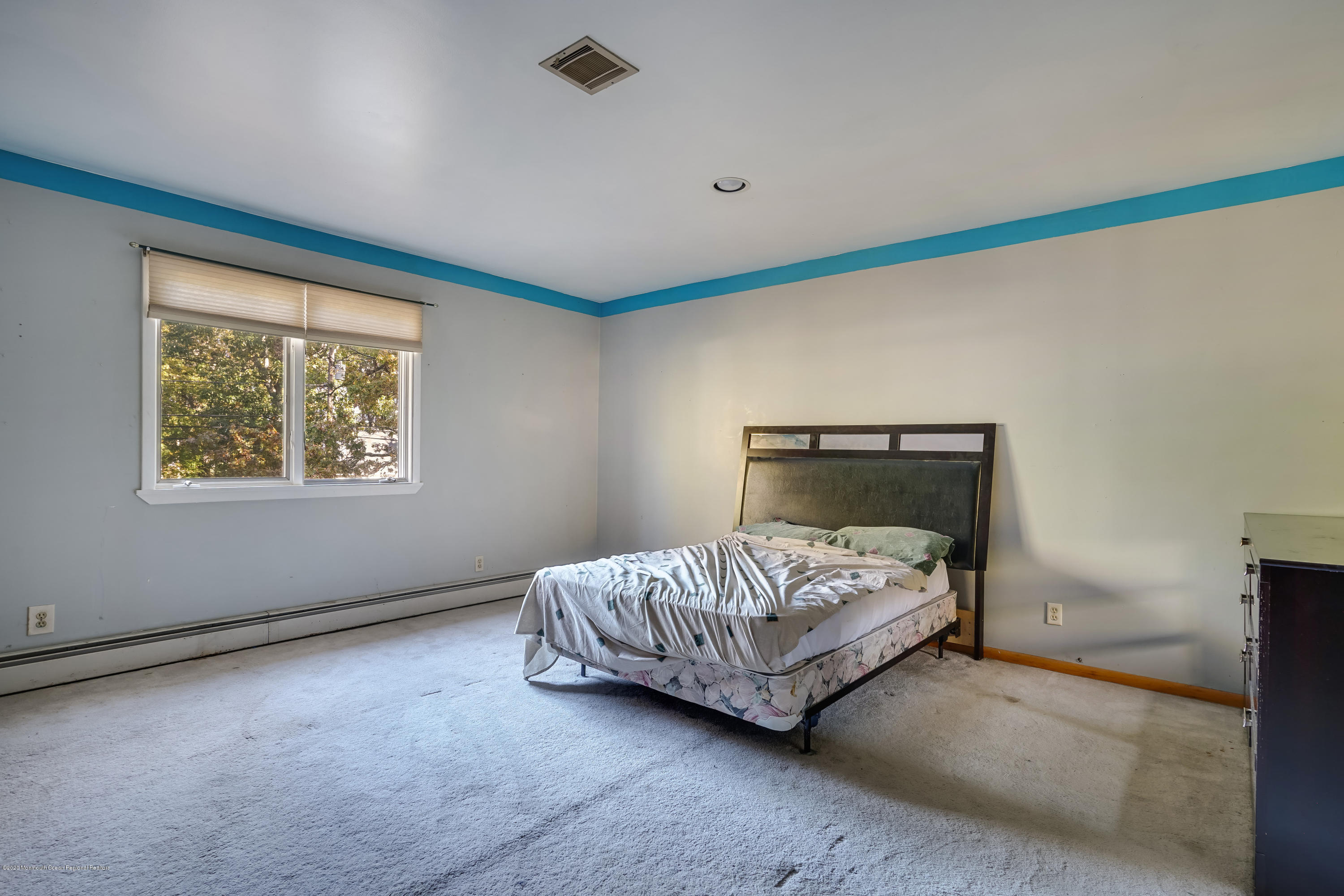 43 Korman Road Bayville, NJ 08721 - Photo 25 of 47 a bedroom with a bed and window
