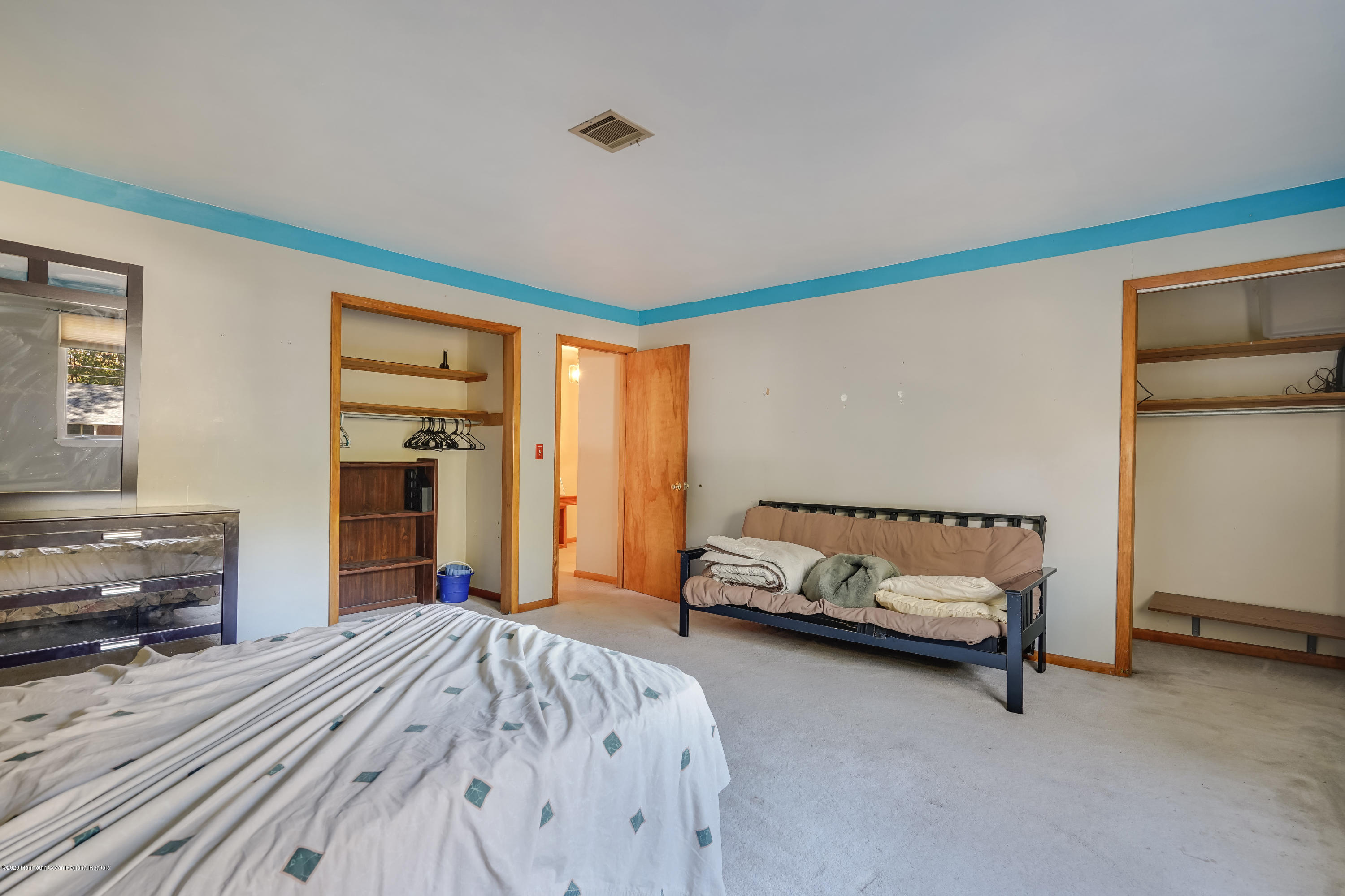 43 Korman Road Bayville, NJ 08721 - Photo 26 of 47 a bedroom with a bed and a couch