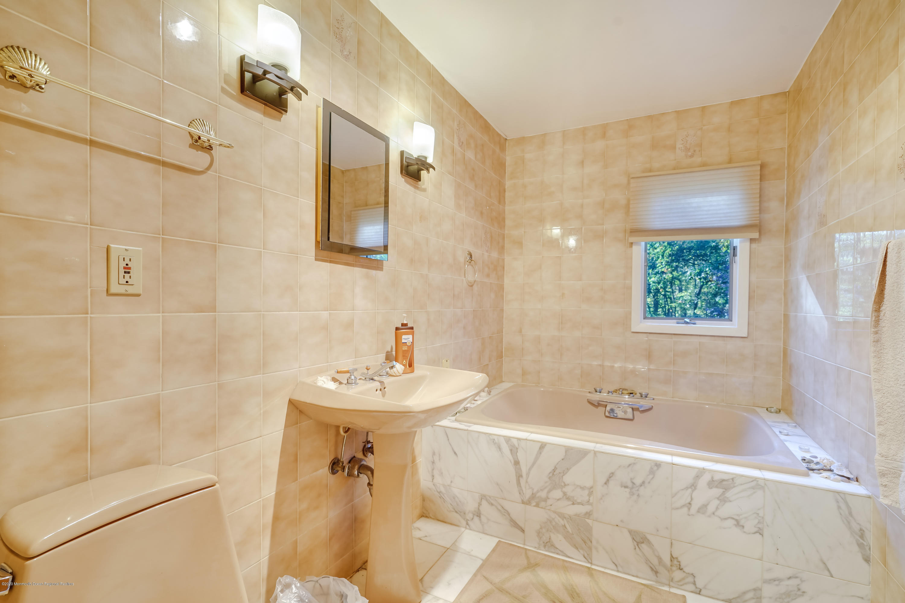 43 Korman Road Bayville, NJ 08721 - Photo 27 of 47 a bathroom with a sink a mirror and a shower