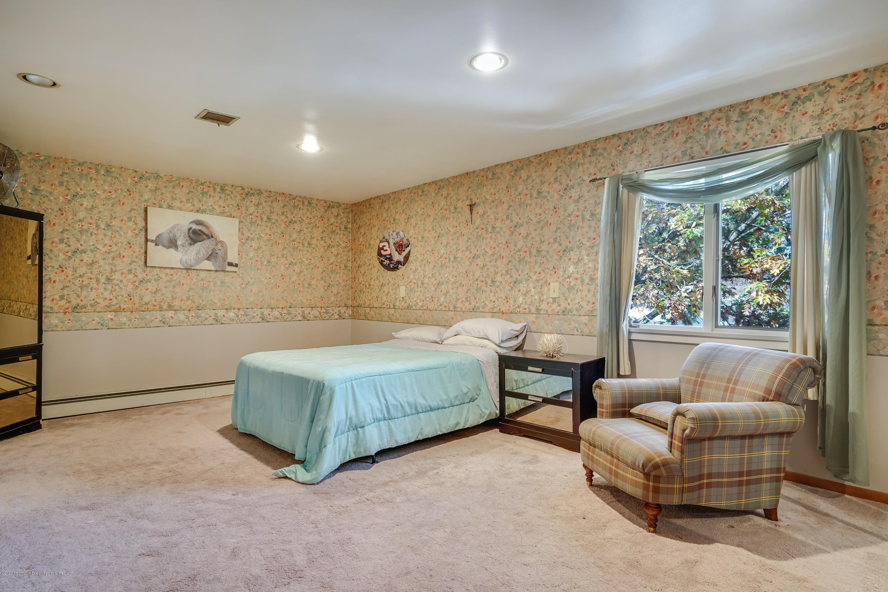 43 Korman Road Bayville, NJ 08721 - Photo 31 of 47 a bedroom with a bed couch and window
