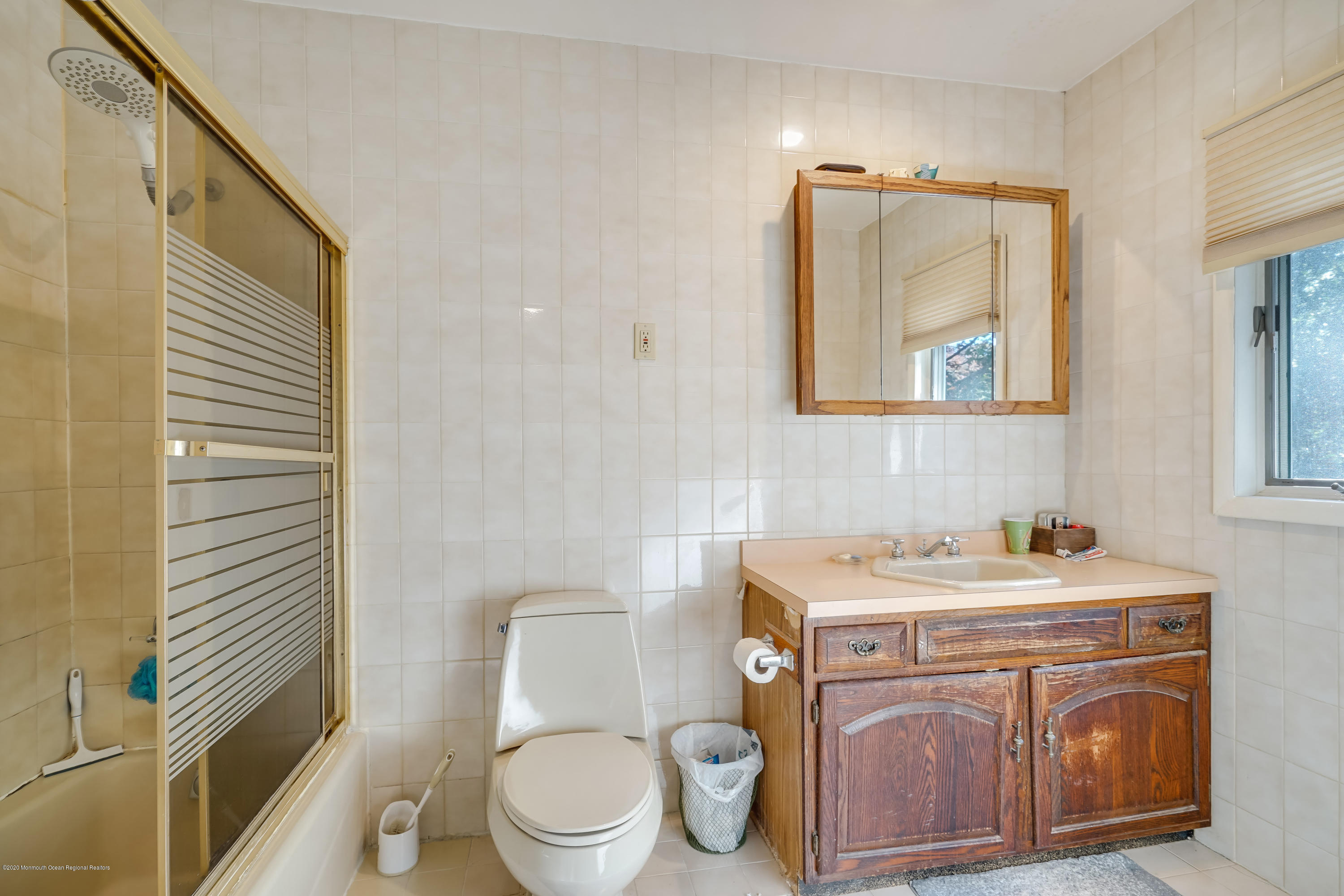 43 Korman Road Bayville, NJ 08721 - Photo 33 of 47 a bathroom with a toilet a sink and mirror