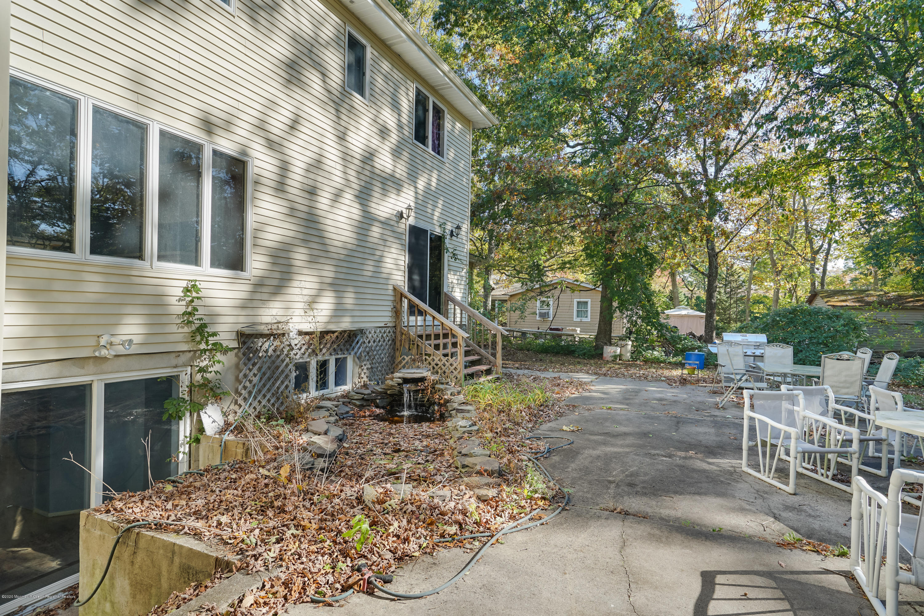 43 Korman Road Bayville, NJ 08721 - Photo 44 of 47 a view of a house with a yard and sitting area