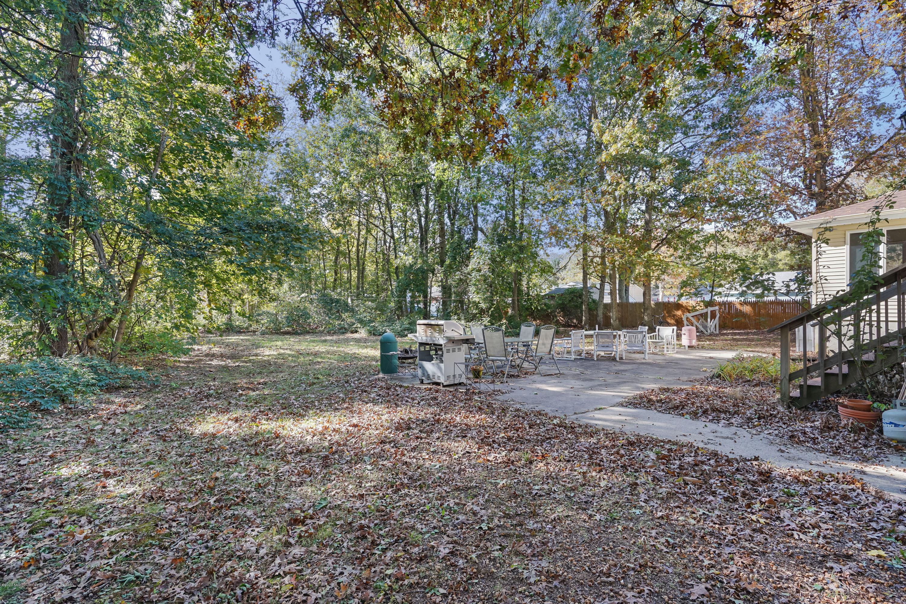 43 Korman Road Bayville, NJ 08721 - Photo 45 of 47 a backyard of a house with lots of green space