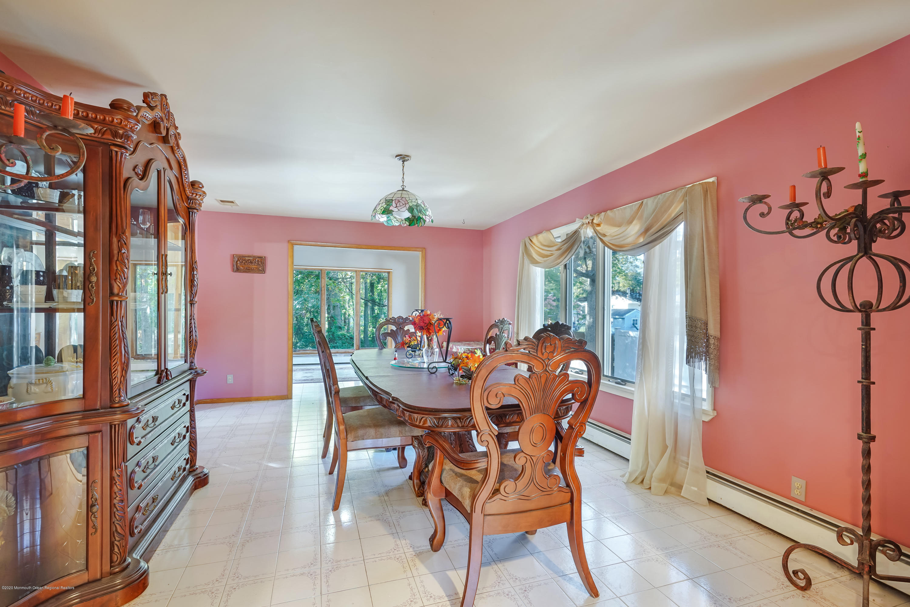 43 Korman Road Bayville, NJ 08721 - Photo 8 of 47 a dining room with furniture and a floor to ceiling window
