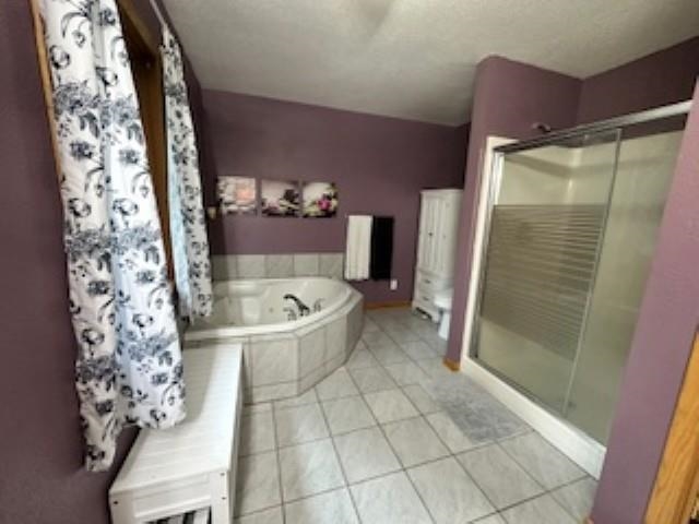 7345 Rahkola Road Embarrass, MN 55732 - Photo 28 of 57 Bathroom featuring a stall shower, a bath, and light tile patterned floors