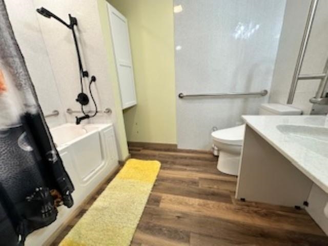 7345 Rahkola Road Embarrass, MN 55732 - Photo 39 of 57 Bathroom featuring vanity, dark wood finished floors, and shower / bath combination with curtain