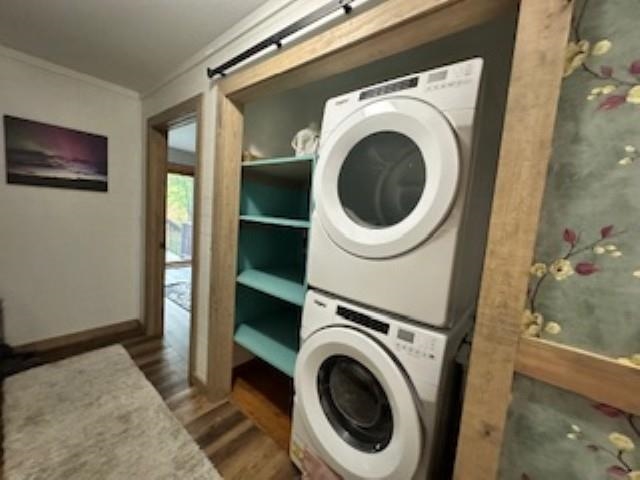 7345 Rahkola Road Embarrass, MN 55732 - Photo 40 of 57 Laundry room with dark wood-type flooring, estacked washer and dryer, and crown molding