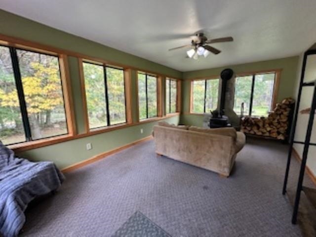 7345 Rahkola Road Embarrass, MN 55732 - Photo 8 of 57 Sunroom featuring a wood stove