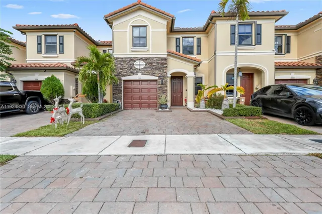 an aerial view of a house with outdoor space and lake view