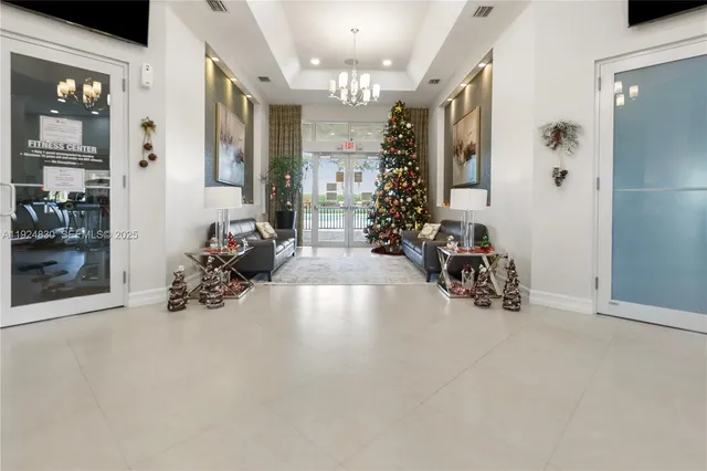 an aerial view of a house with garden space and swimming pool