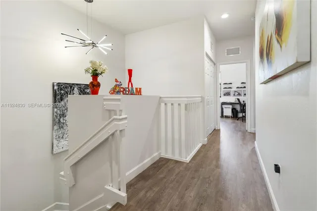 a room with furniture and wooden floor