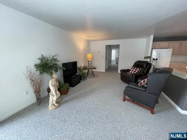 a living room with furniture and gym equipment