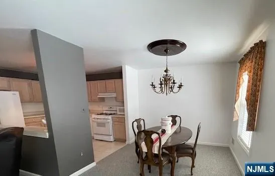 a kitchen with stainless steel appliances a refrigerator a sink and a stove