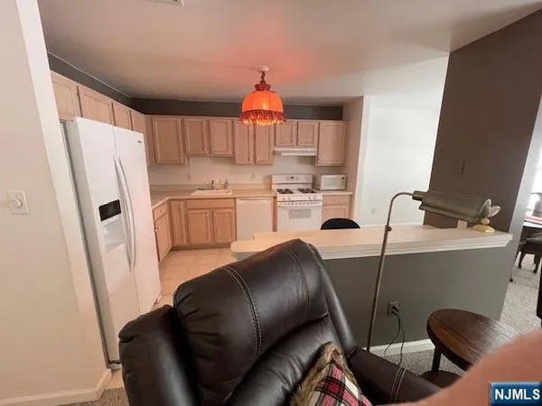 a bathroom with a sink mirror and shower