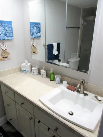 a bathroom with a sink and a mirror