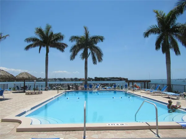 a view of swimming pool with chairs