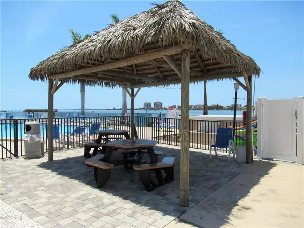 a view of a swimming pool and lounge chairs