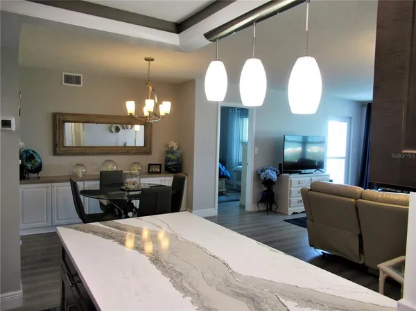 a kitchen with a table and chairs in it