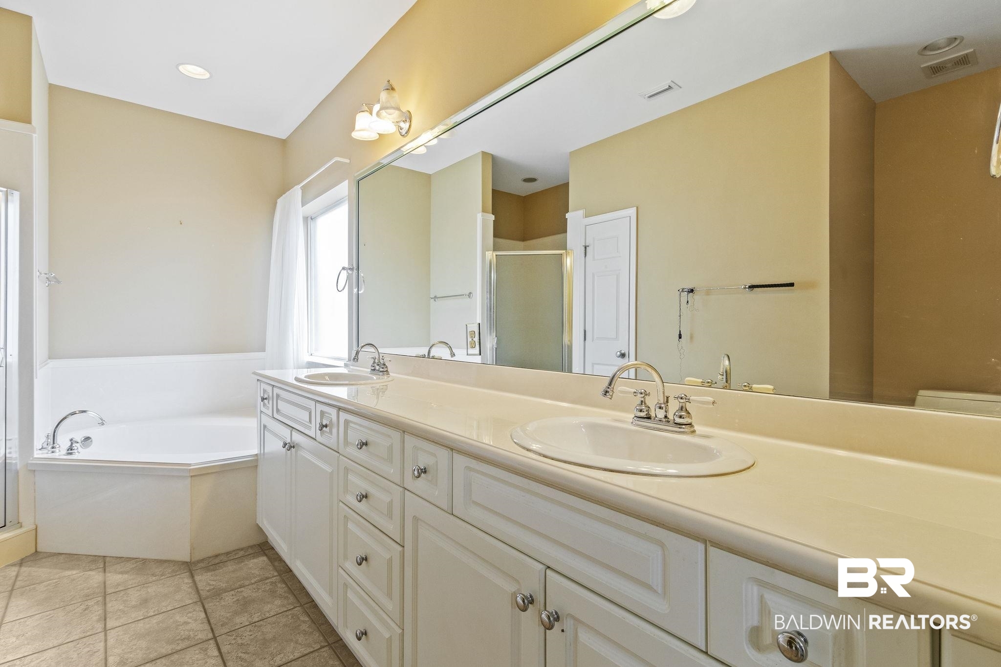166 Club Drive Fairhope, AL 36532 - Photo 23 of 41 Bathroom with vanity, separate shower and tub, and tile patterned flooring