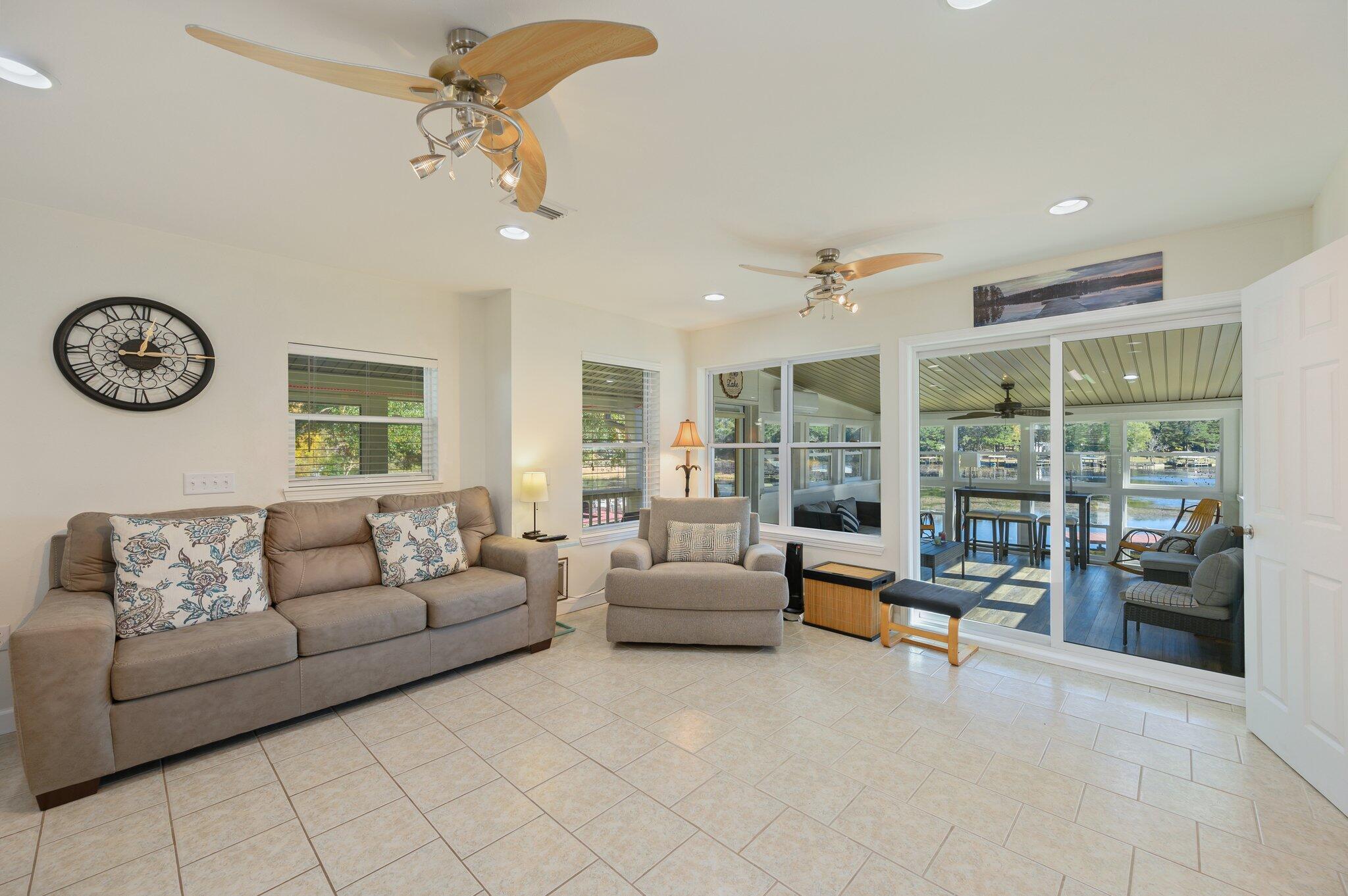 883 Squirrel Road DeFuniak Springs, FL 32433 - Photo 17 of 57 a living room with furniture and a large window