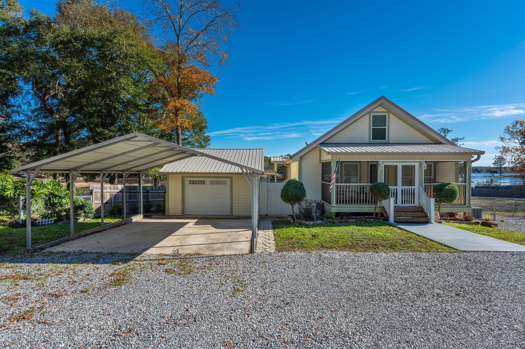 883 Squirrel Road DeFuniak Springs, FL 32433 - Photo 2 of 57 a front view of a house with a yard