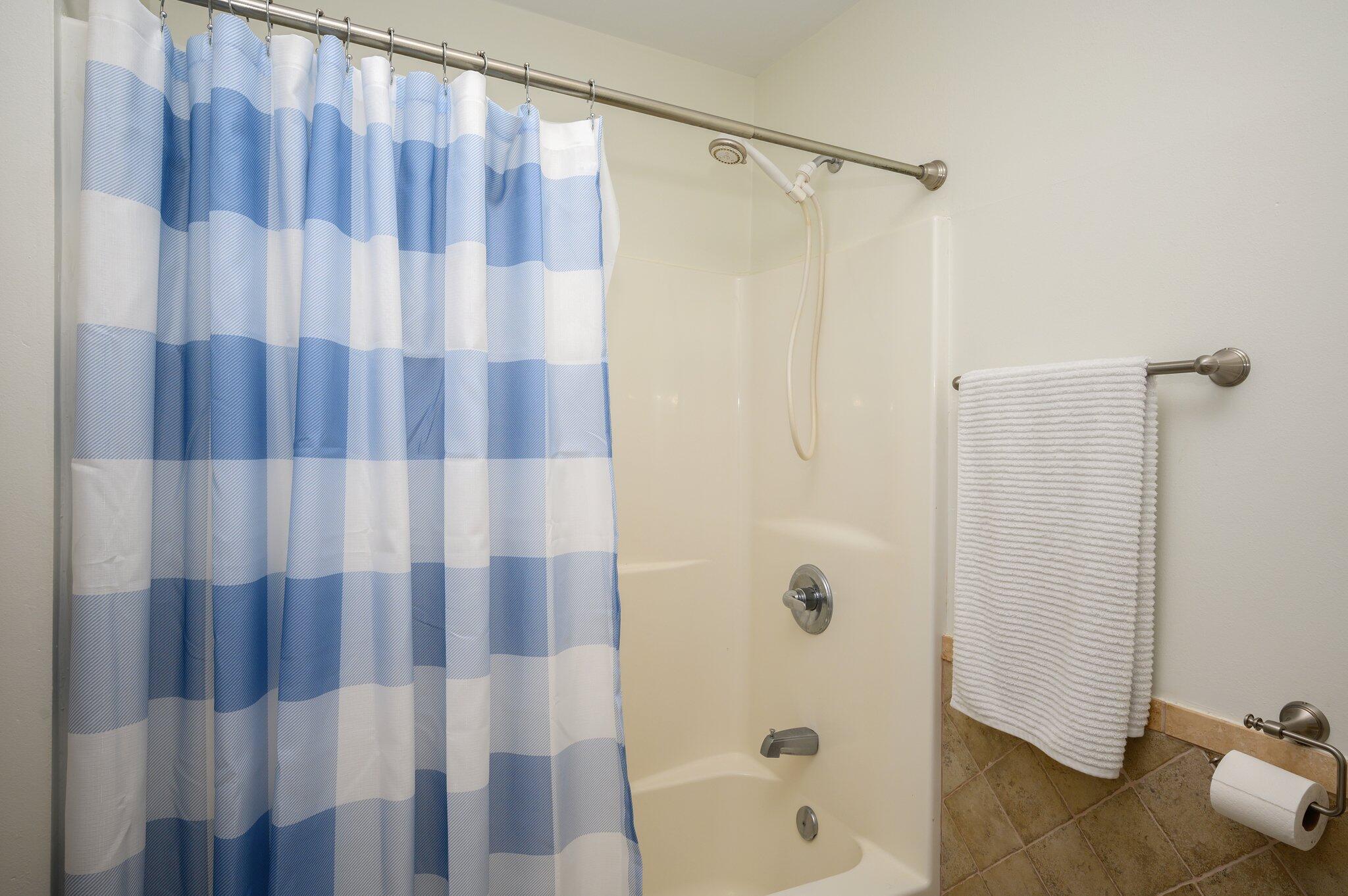 883 Squirrel Road DeFuniak Springs, FL 32433 - Photo 23 of 57 a bathroom with a shower curtain
