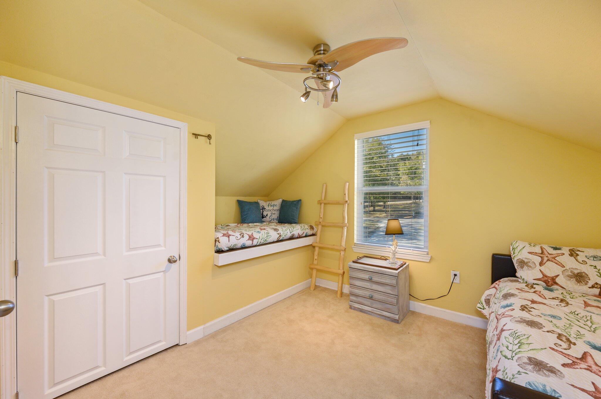 883 Squirrel Road DeFuniak Springs, FL 32433 - Photo 26 of 57 a living room with furniture and a chandelier