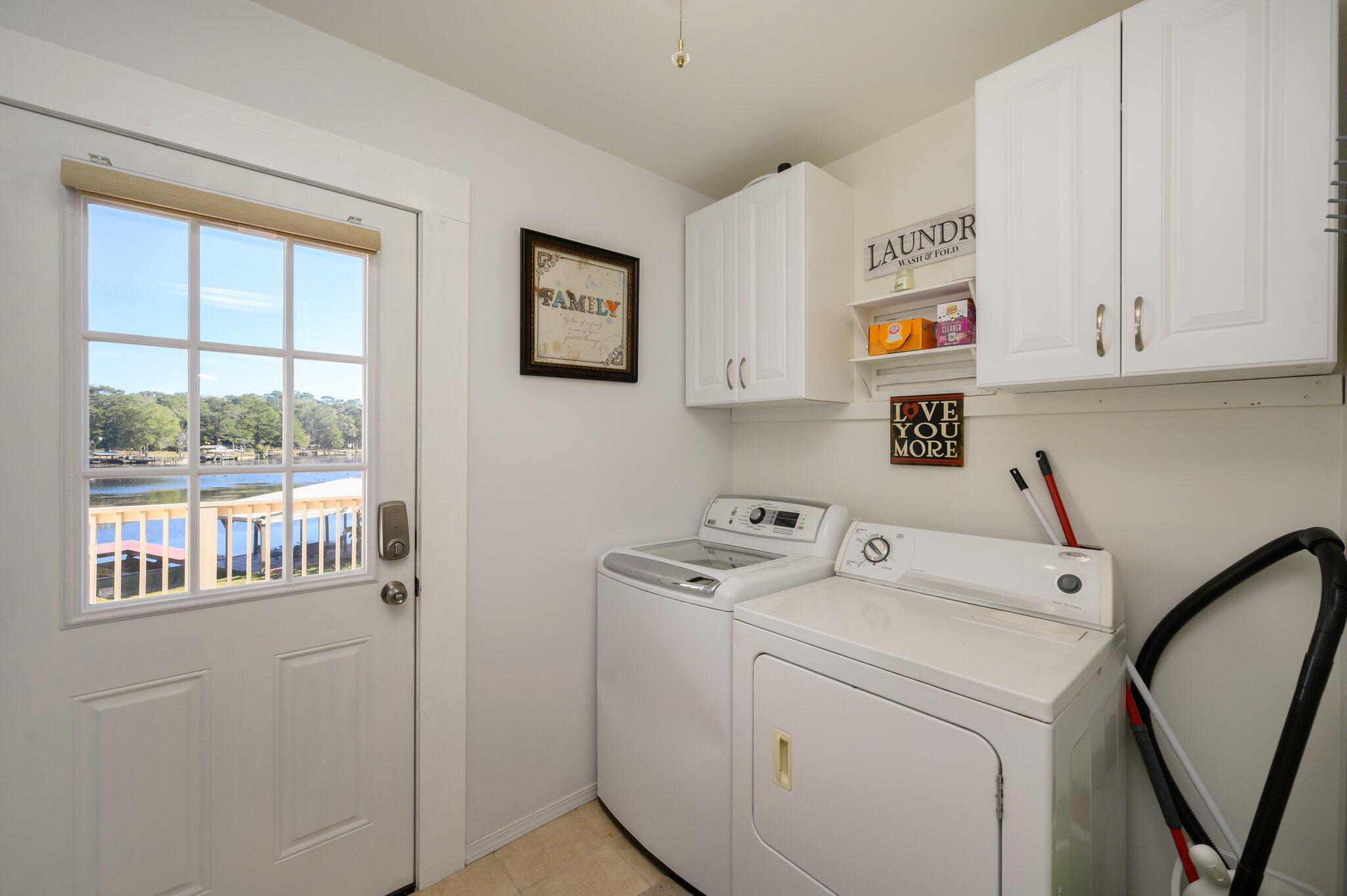 883 Squirrel Road DeFuniak Springs, FL 32433 - Photo 33 of 57 a view of storage and utility room with washer and dryer