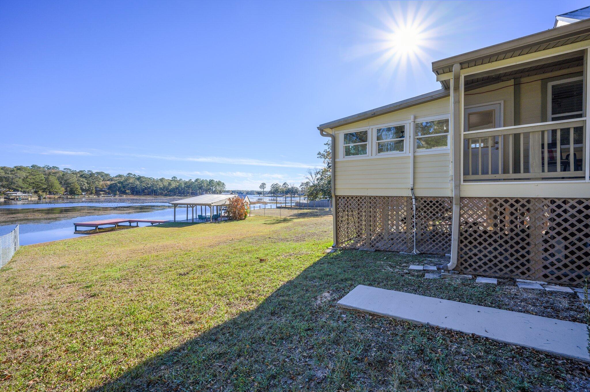 883 Squirrel Road DeFuniak Springs, FL 32433 - Photo 40 of 57 a view of a yard with an ocean view