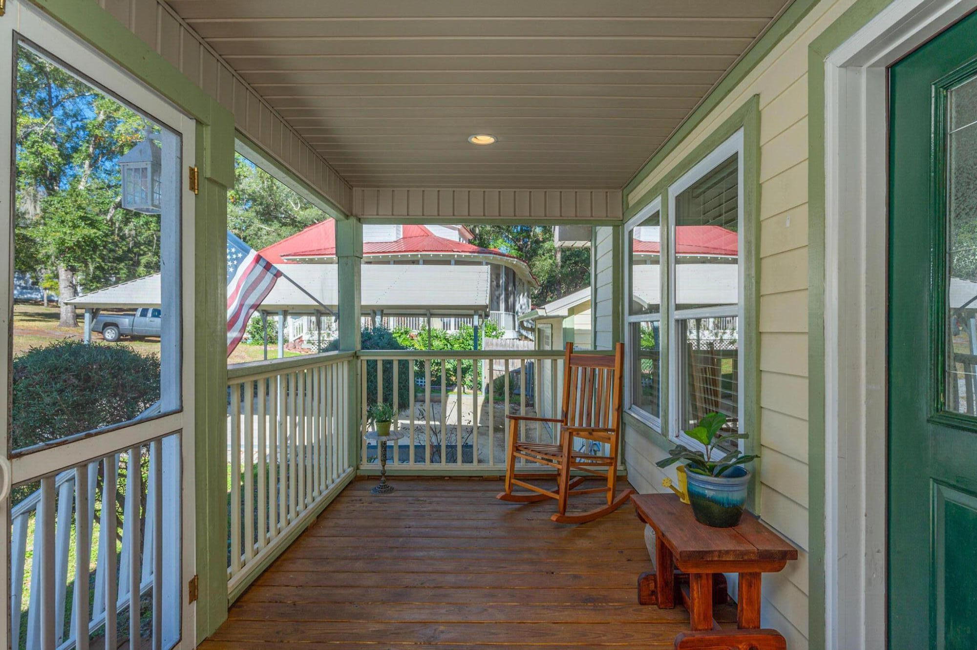 883 Squirrel Road DeFuniak Springs, FL 32433 - Photo 5 of 57 a balcony with furniture and a potted plant