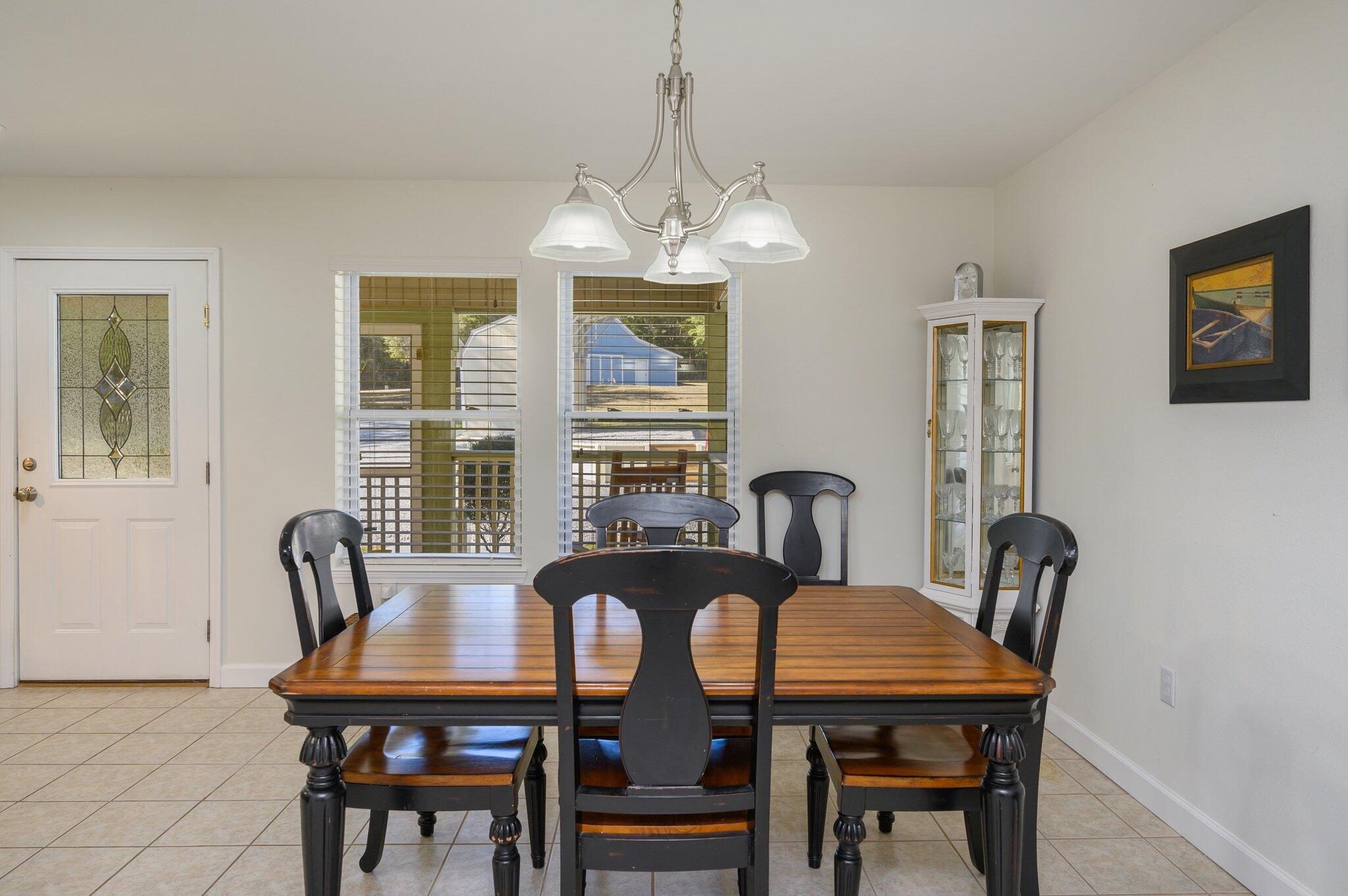 883 Squirrel Road DeFuniak Springs, FL 32433 - Photo 9 of 57 a view of a dining room with furniture window and outside view