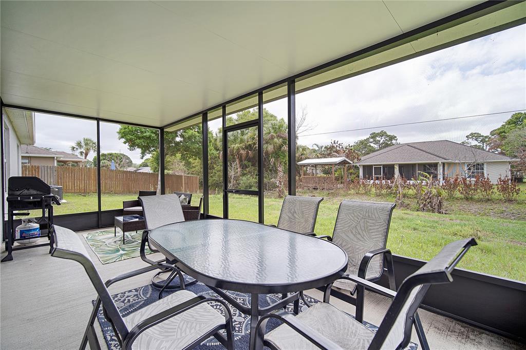 418 Fleming Street Sebastian, FL 32958 - Photo 29 of 38 a view of a dining room with furniture window and outside view