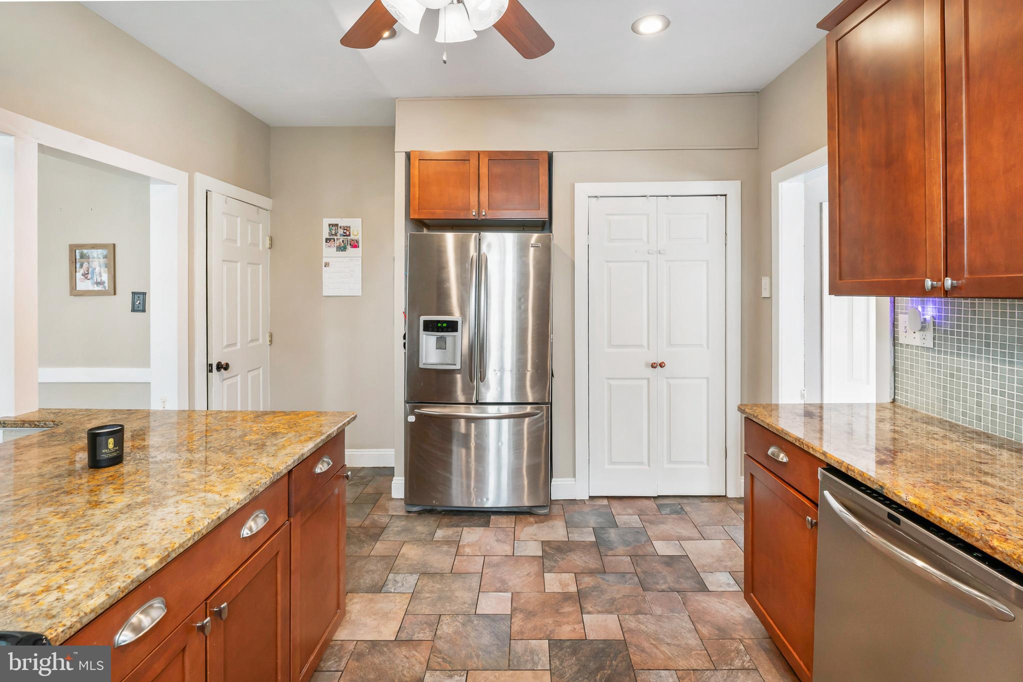 731 Washington Avenue Palmyra, NJ 08065 - Photo 13 of 40 a kitchen with stainless steel appliances granite countertop a refrigerator and a sink