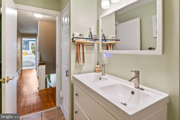a bathroom with a sink and a mirror