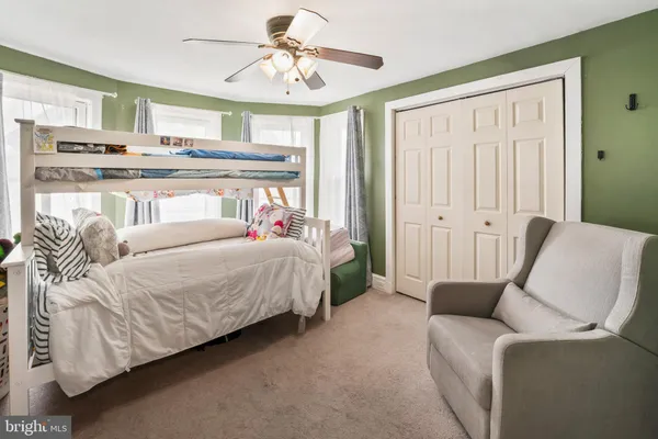 a bed room with a bed and a couch