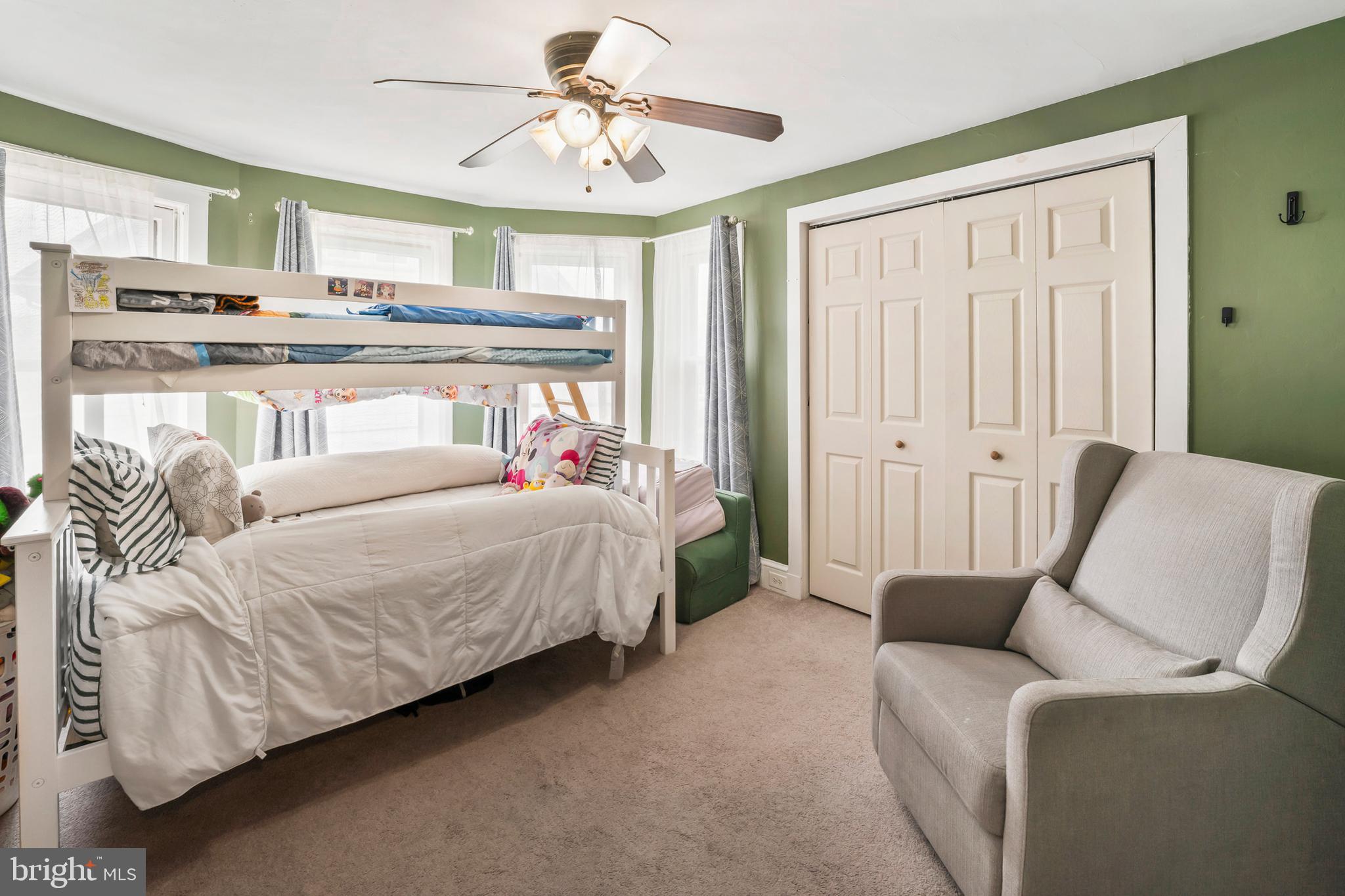 731 Washington Avenue Palmyra, NJ 08065 - Photo 19 of 40 a bed room with a bed and a couch