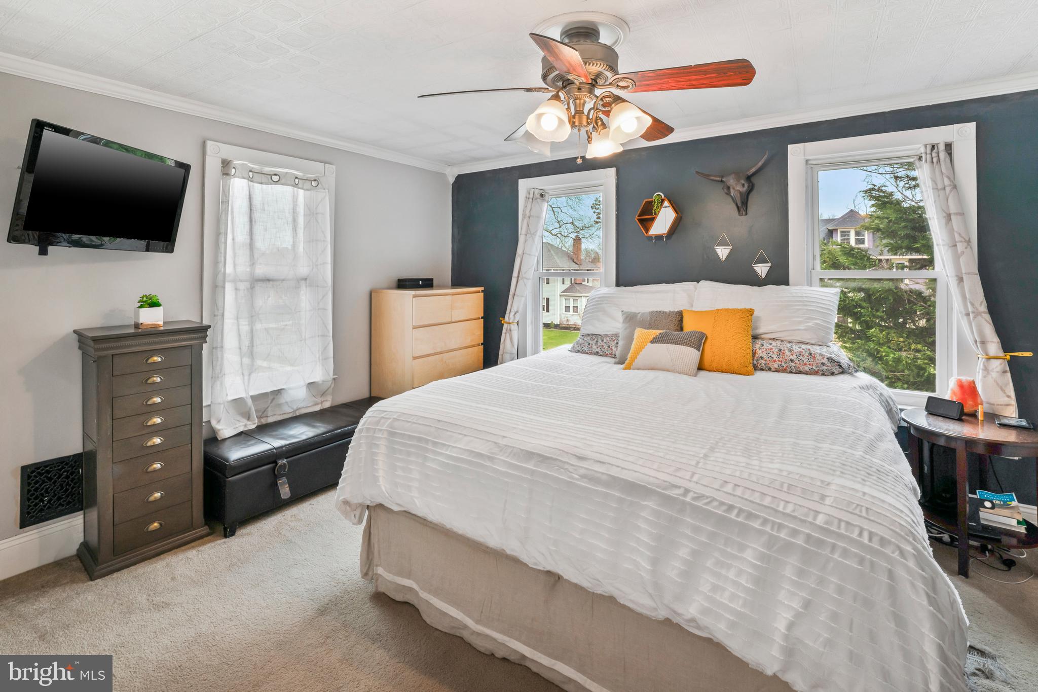 731 Washington Avenue Palmyra, NJ 08065 - Photo 23 of 40 a bedroom with a bed and a flat screen tv