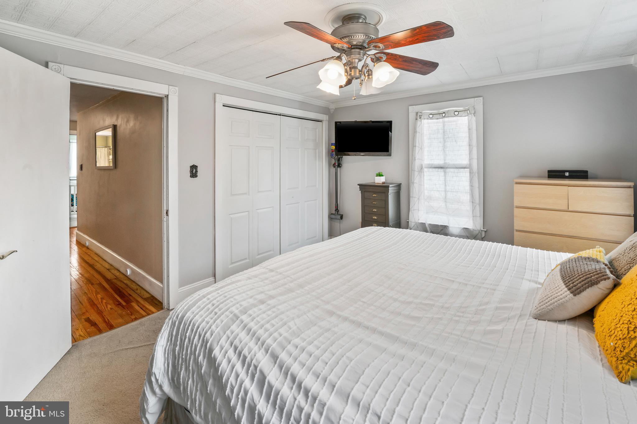 731 Washington Avenue Palmyra, NJ 08065 - Photo 24 of 40 a bedroom with a bed and a chandelier