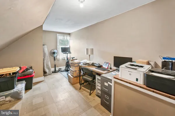a view of a workspace with furniture and toys