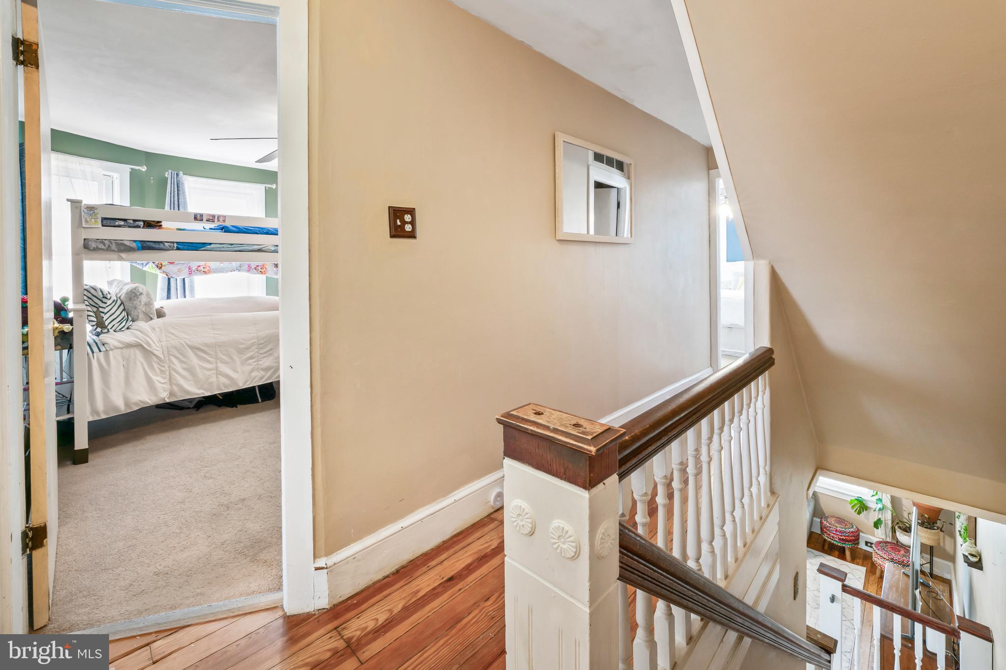 731 Washington Avenue Palmyra, NJ 08065 - Photo 27 of 40 a view of a hallway to a livingroom with furniture and stairs