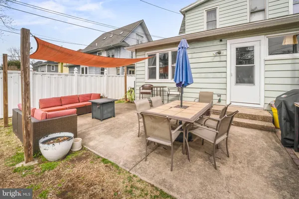a outdoor space with patio a couch and wooden floor